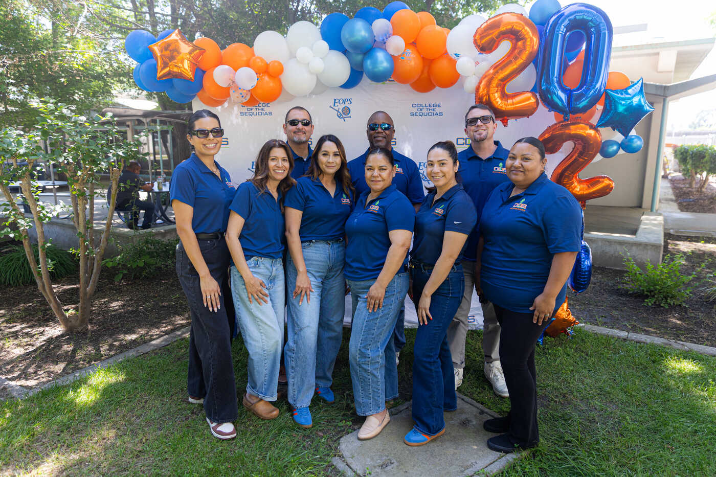 a group of people posing for a photo