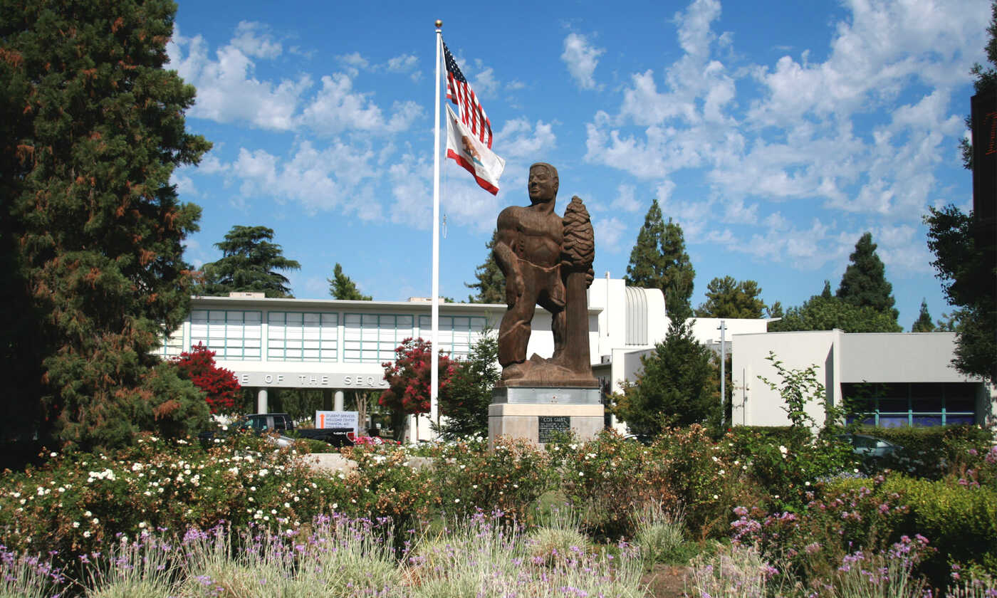 a statue in front of a building